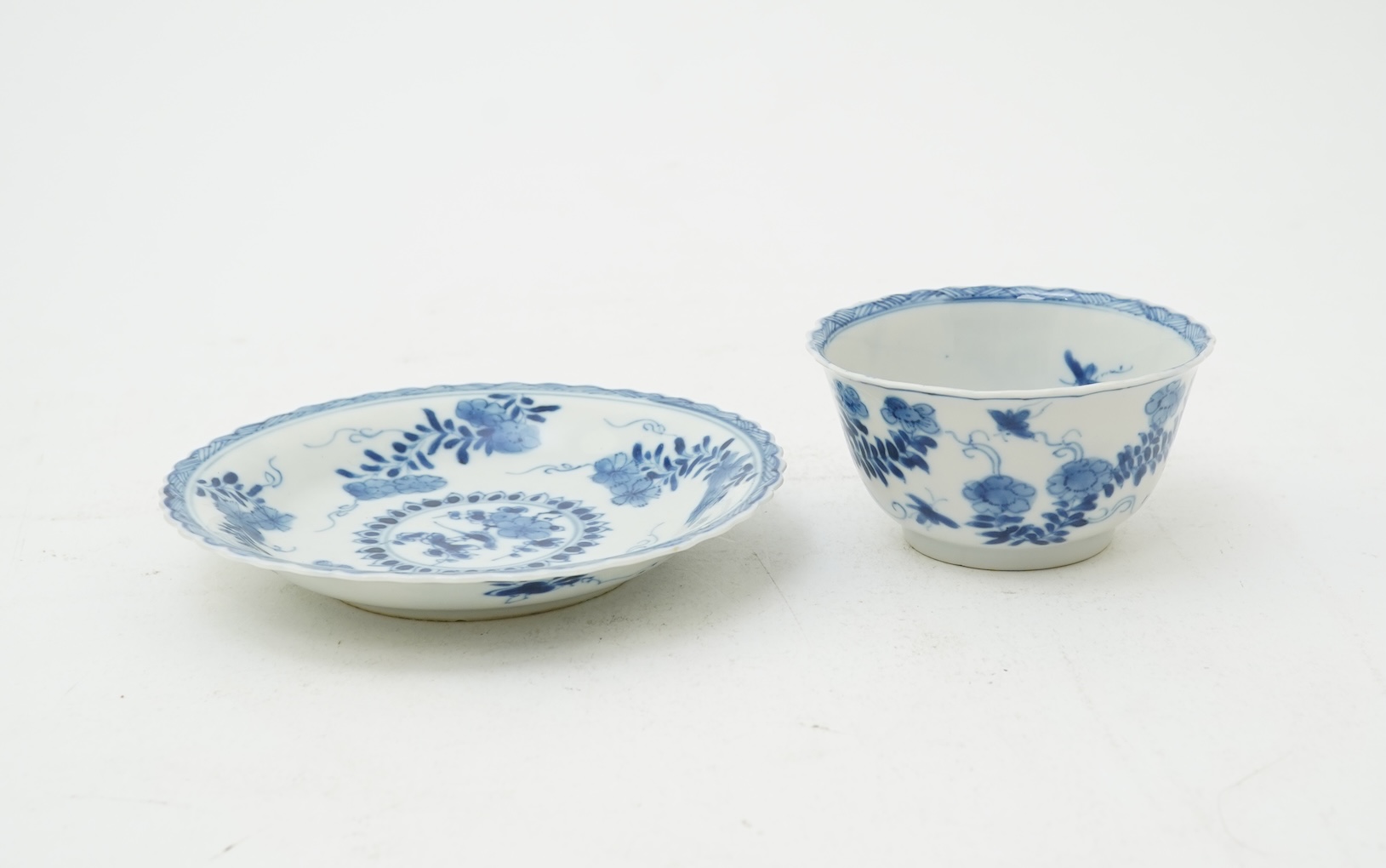 A Chinese blue and white tea bowl and saucer, Kangxi period